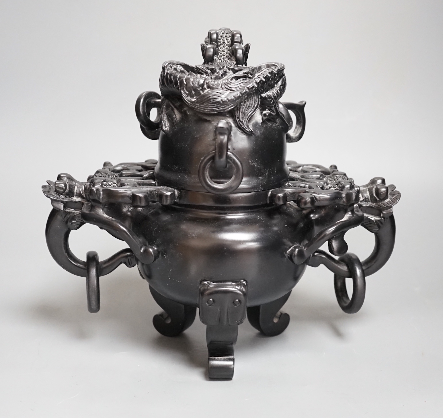 A large decorative Chinese black hardstone tripod censer and cover - 25.5cm high
